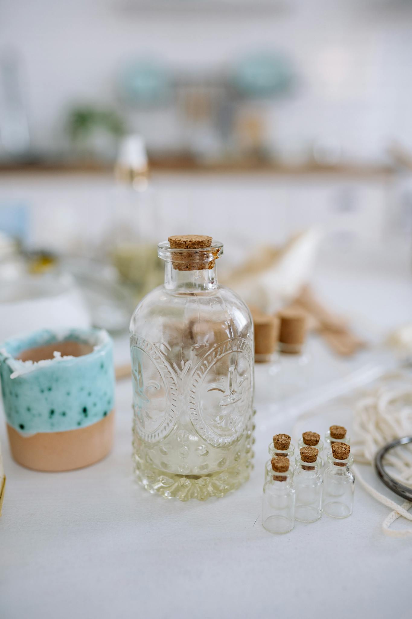 Beautiful glass bottles with cork stoppers on a bright surface, perfect for decor and storage inspiration.